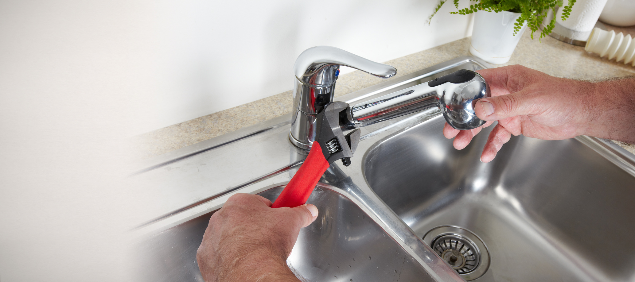 Plumber with wrench.